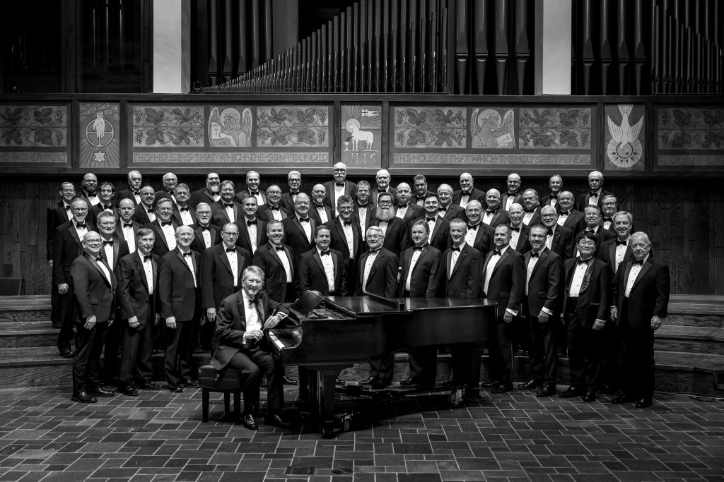 Formal black and white photo of the River City Men's Chorus