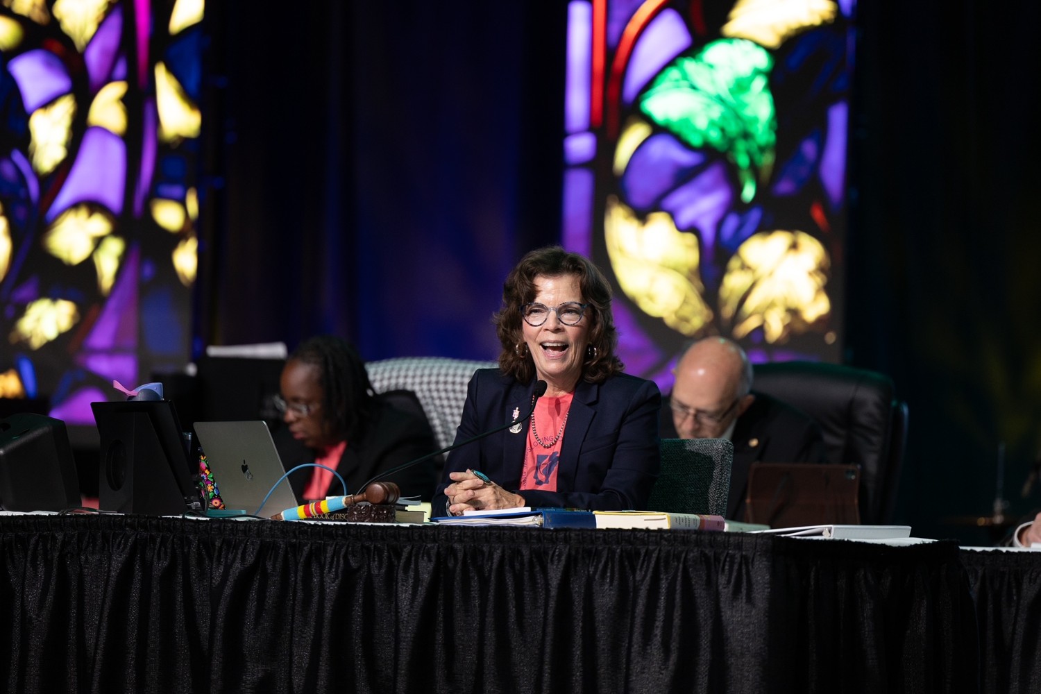 Bishop and conference leaders at a table