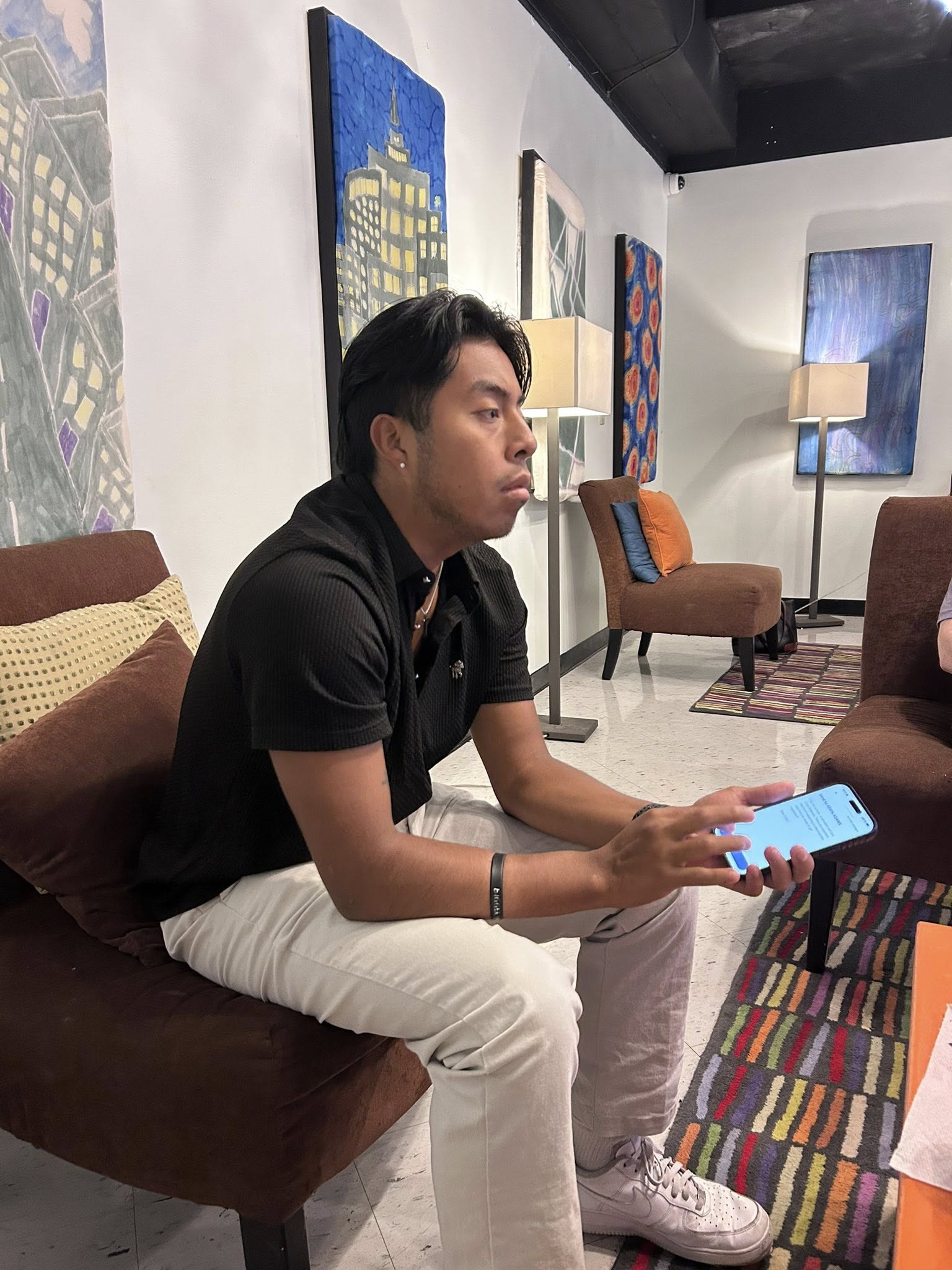 A young man texting on his pone